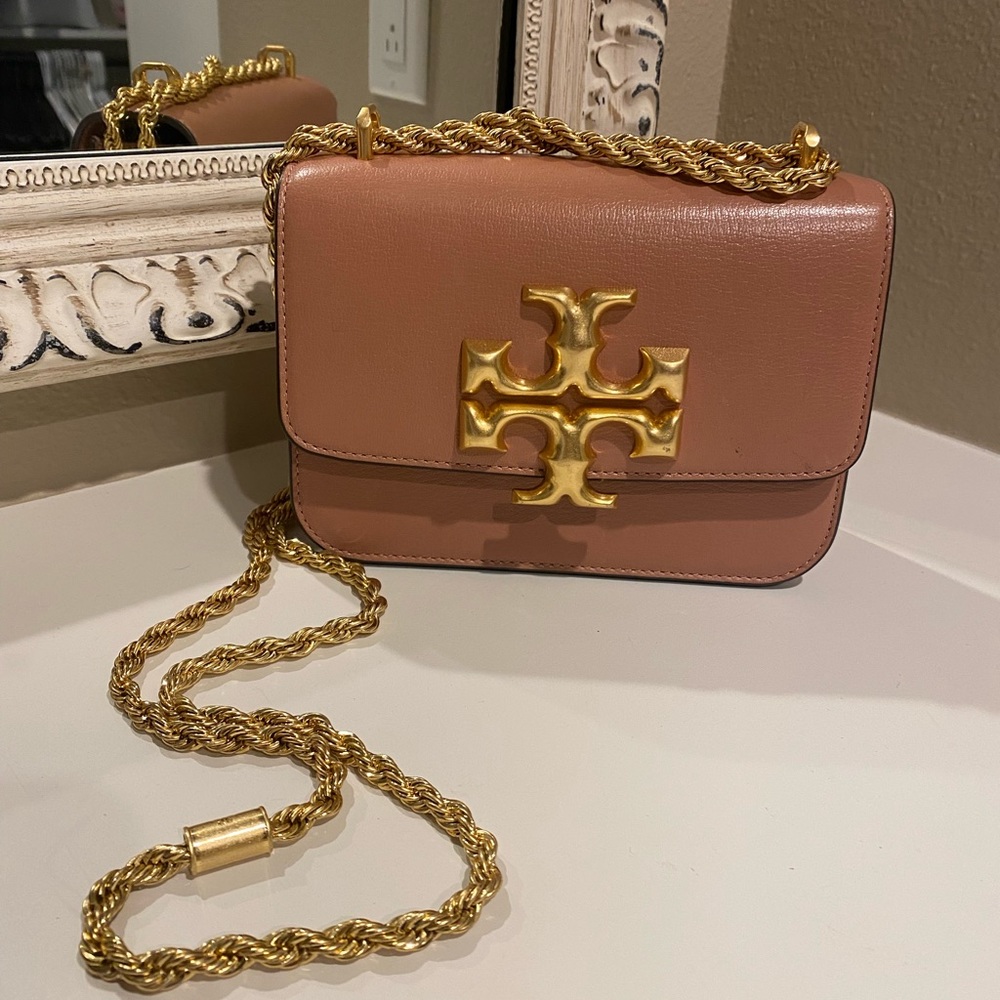 Tory Burch used couple of times. Still selling in stores for regular price.